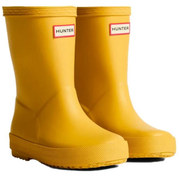 Pair of yellow Hunter boots on a white background