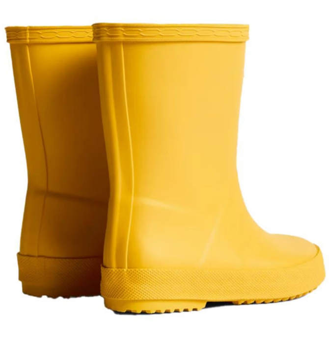 Pair of yellow rubber boots on a white background
