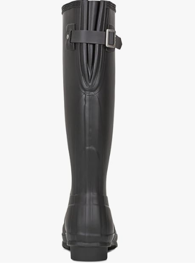 Th back adjustment on a navy hunter wellington boot on a white background