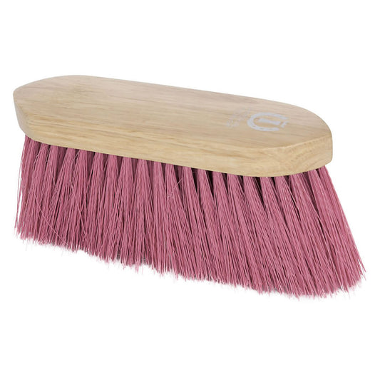 Brush with pink bristles and a wooden handle on a white background