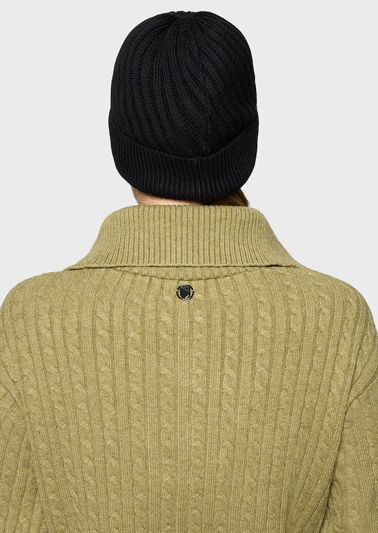 Back view of a person wearing a ribbed olive green cable-knit sweater and a dark burgundy knit beanie against a light gray background.