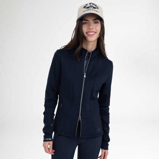 Girl wearing a navy full zip sweatshirt, a pair of navy tights and a navy and beige baseball cap on a white background