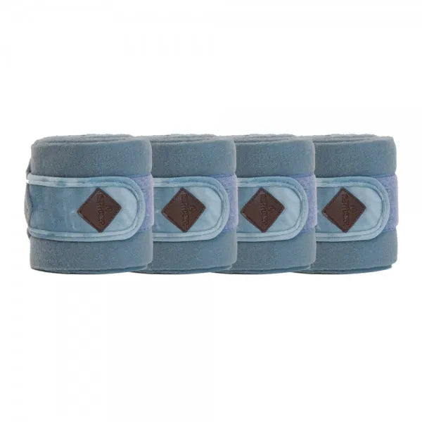 Four blue bandages with brown diamond pattern on a white background
