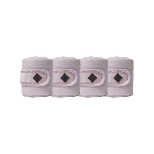 four pink bandages with diamond patterns on a white background