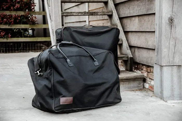 A deluxe stable grooming bag in an outdoor setting with tree