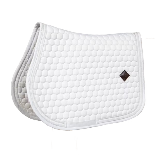 White quilted saddle pad with a diamond pattern on a white background