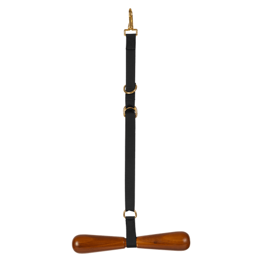 A black leather strap with a wooden T-shaped handle and gold-tone metal hardware, shown against a plain white background.