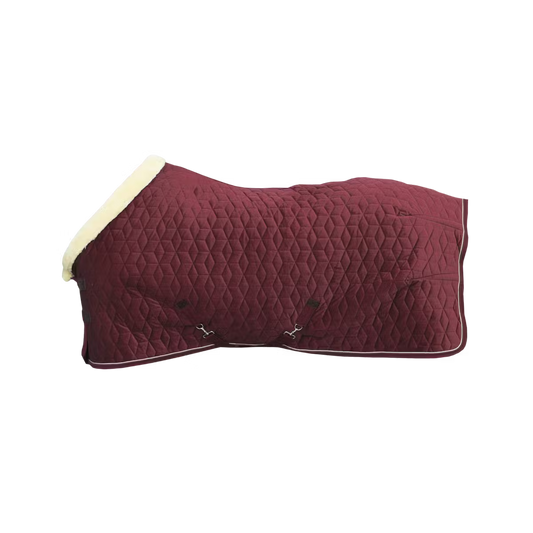 Maroon quilted horse blanket with white fur trim on a black background