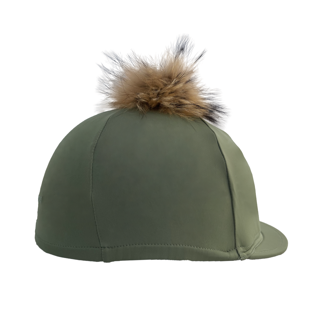 Green riding hat with a fur pom-pom on a white background