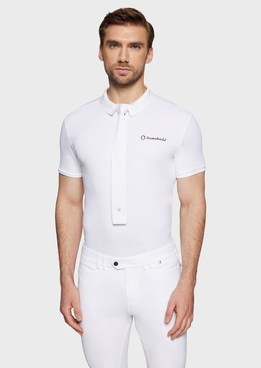 Man wearing a white competition outfit complete with a white tie.