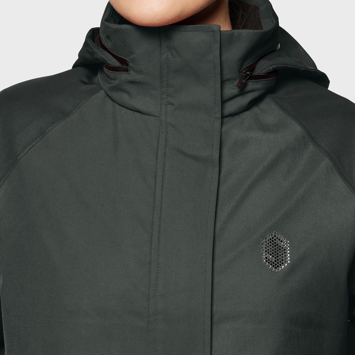 Dark green jacket with a brand logo on a light gray background
