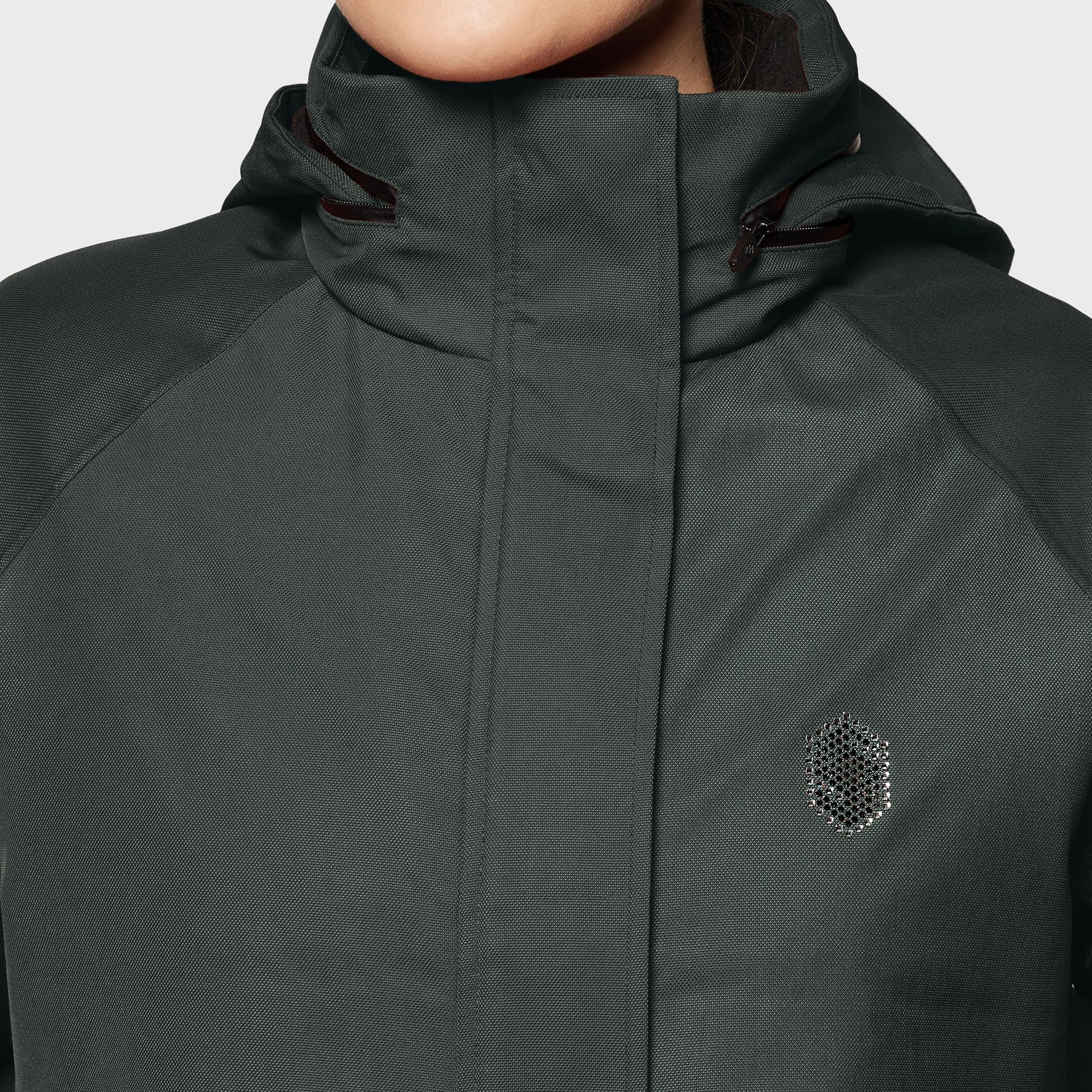 Dark green jacket with a brand logo on a light gray background