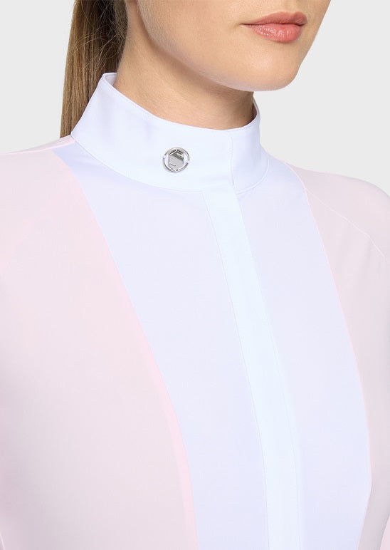 Close-up of a model wearing a high mock neck equestrian riding shirt in white and pale pink with a silver snap button at the collar.