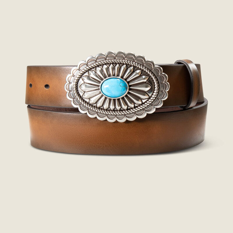 Brown leather belt with a silver and turquoise concho on a beige background