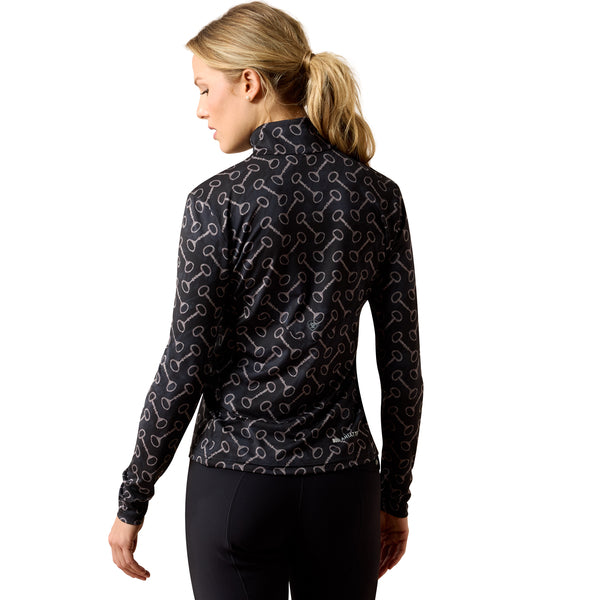Woman wearing a black patterned baselayer on a white background