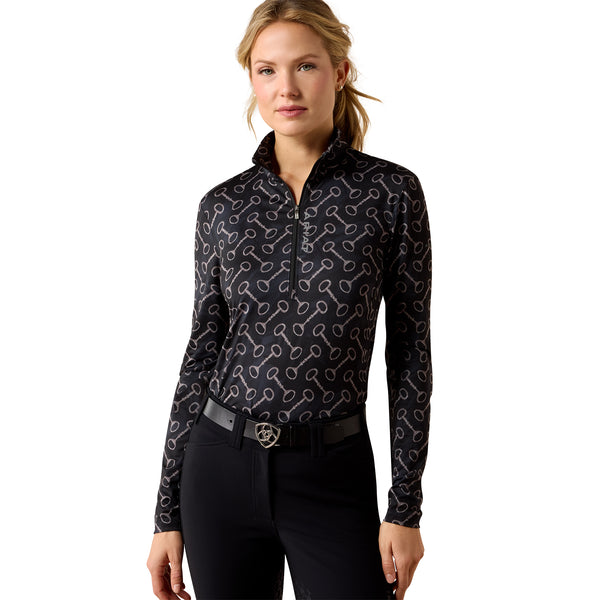 Woman wearing a black patterned baselayer on a white background
