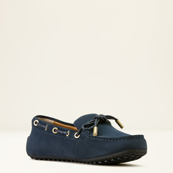 Navy blue loafer shoe on a beige background