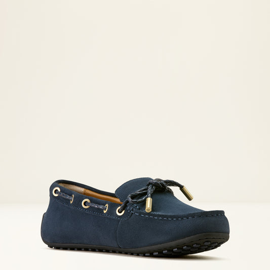 Navy blue loafer shoe on a beige background