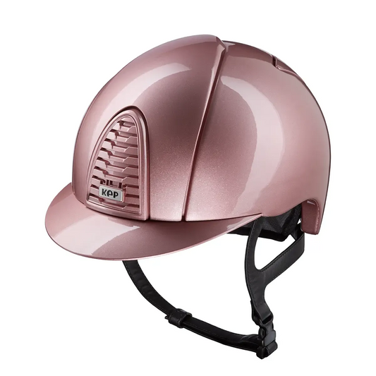 Pink riding helmet with black strap on a white background