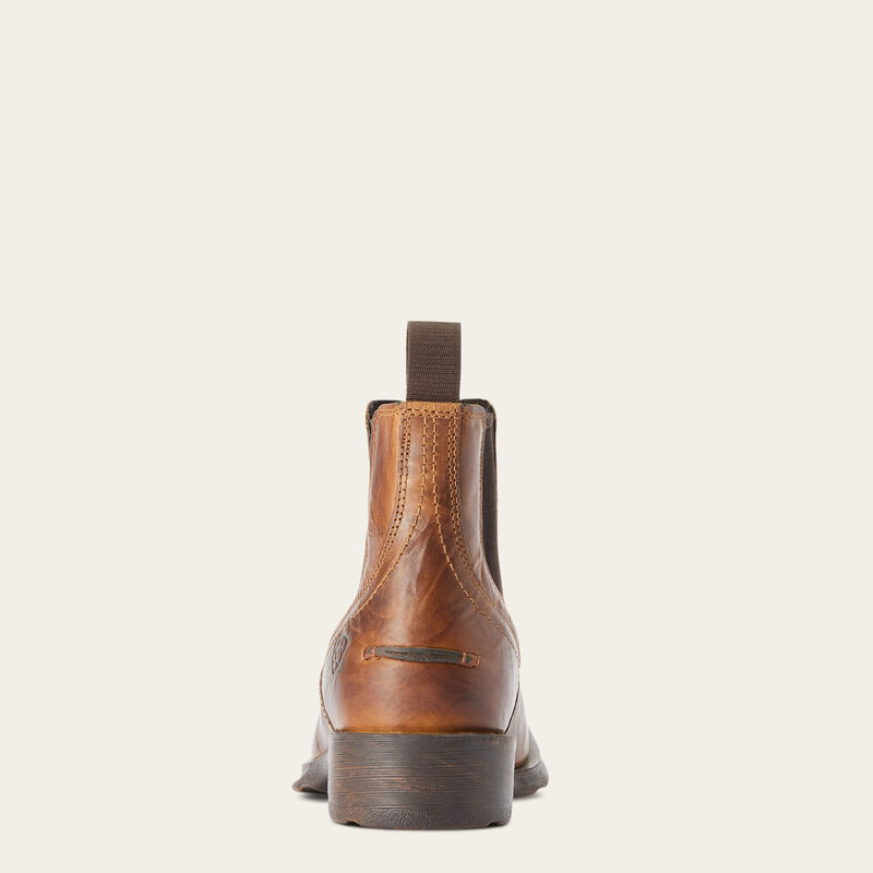 Brown leather boot on a white background