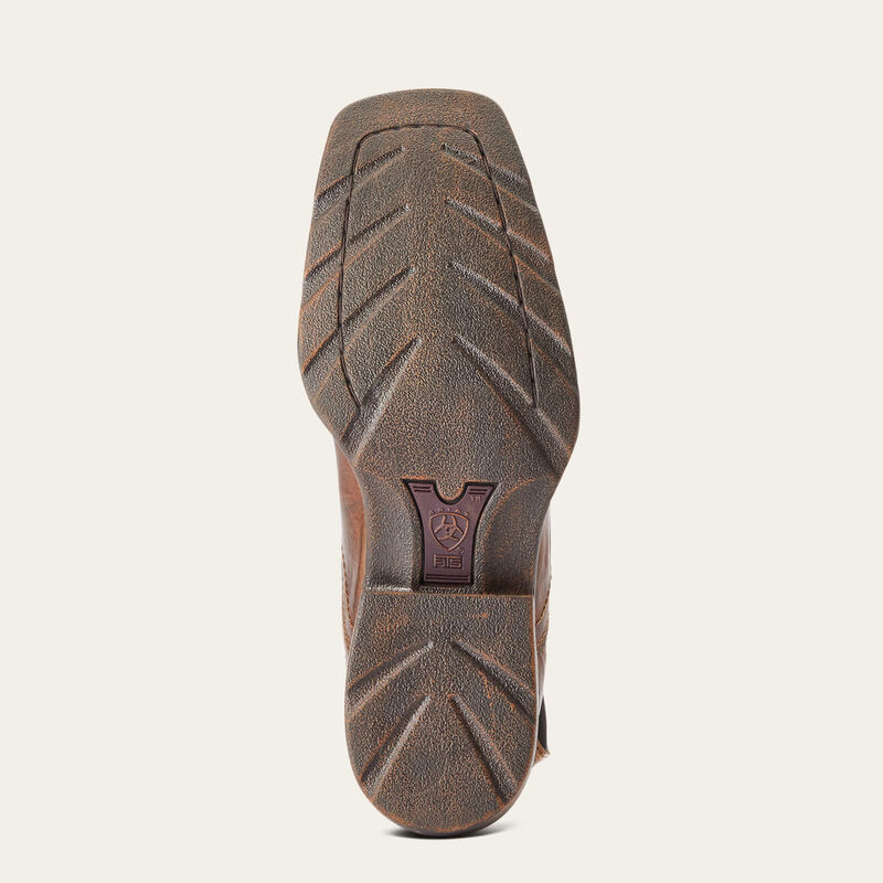 The outsole of a brown leather boot, showing a textured tread pattern and a small embossed logo patch in the center, set against a plain off-white background.