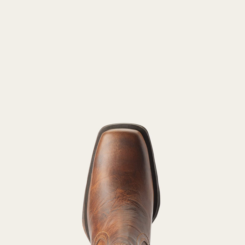 Brown leather boot on a beige background