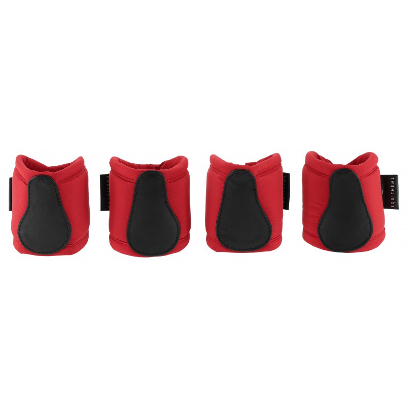 Four red and black protective pads on a white background