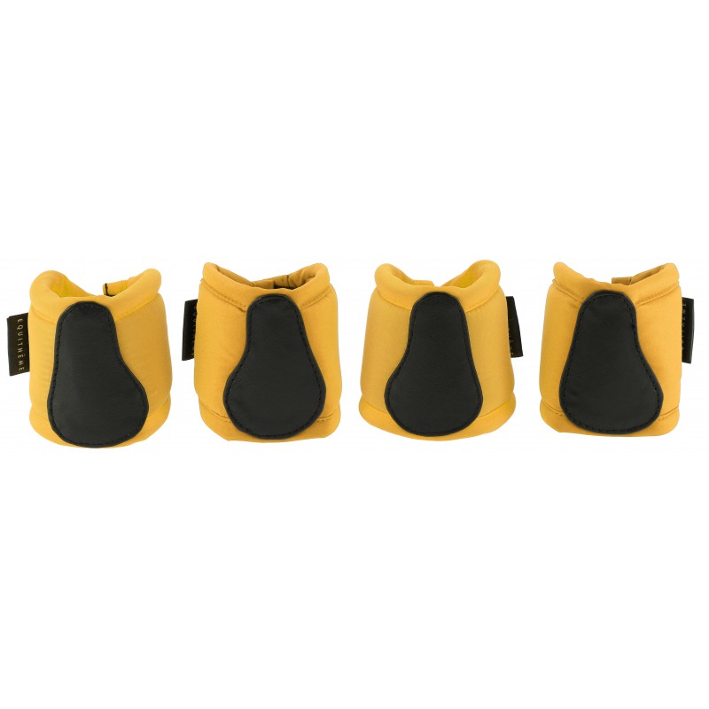 Four yellow and black protective pads on a white background