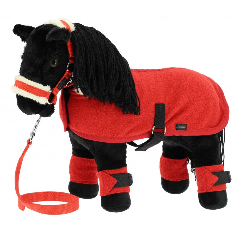 Plush horse toy with a red rug and black legs on a white background