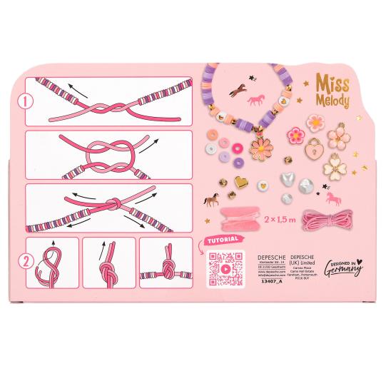 Pink packaging of a bead set kit with tutorials and decorative items on a white background.