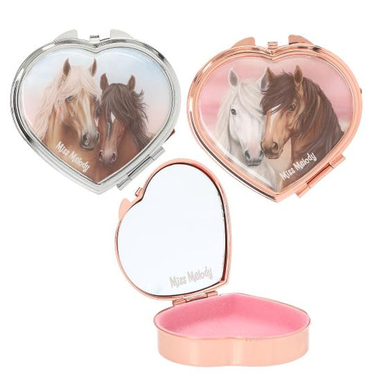 Heart-shaped compact mirror with horse design on a white background