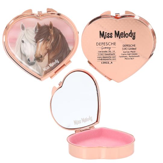 Heart-shaped compact mirror with horse design and 'Miss Melody' branding.