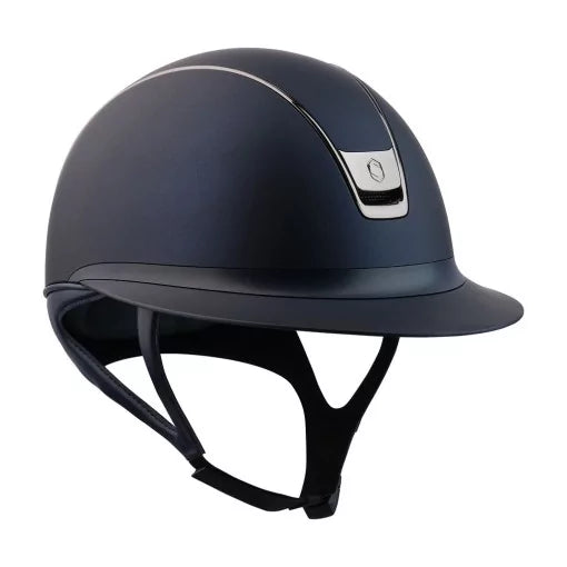 Navy riding helmet with a silver emblem on a white background