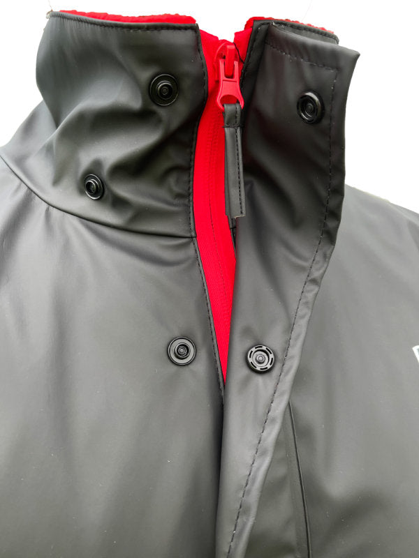 Black jacket with a red zipper on a white background