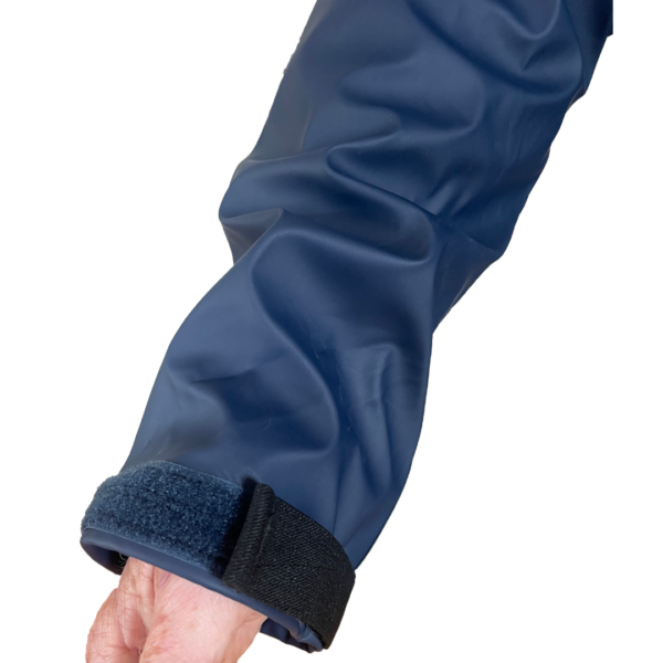 Close-up of a blue sleeve with a black cuff on a white background