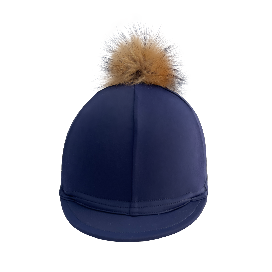 Navy blue cap with a brown fur pom-pom on a white background