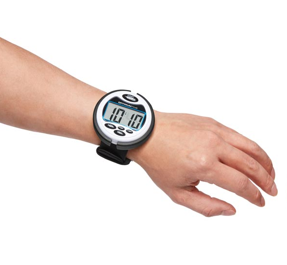 Digital watch on a wrist with a white background