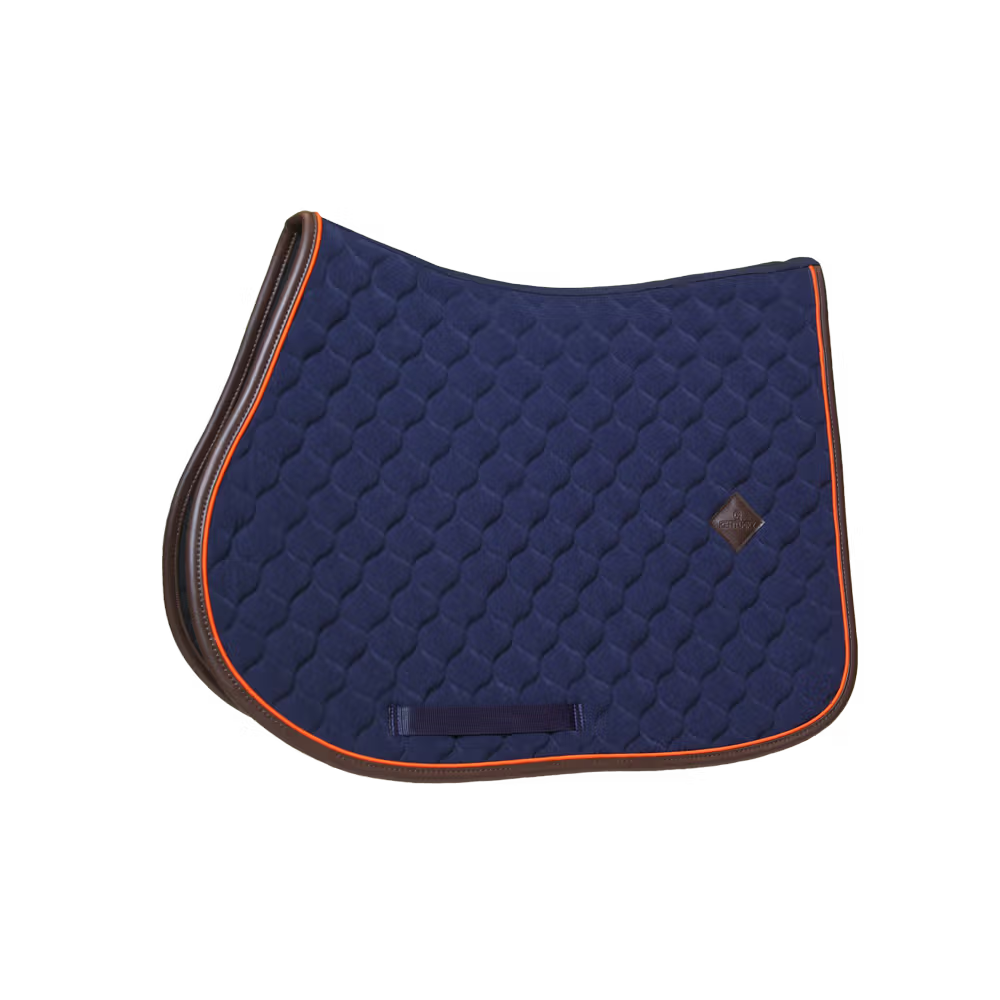 Navy blue quilted saddle pad with orange trim on a white background