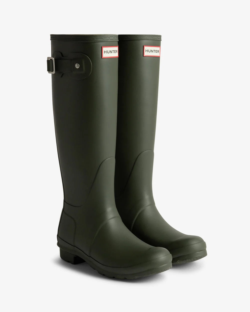 Pair of green Hunter rain boots on a white background