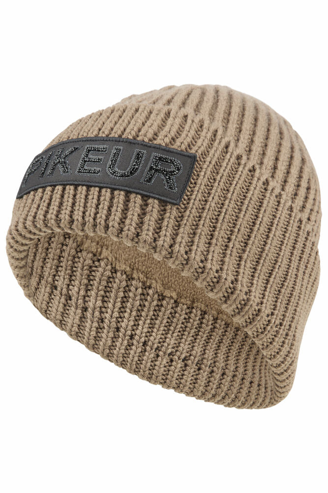 Beige knit beanie with a black patch on a white background
