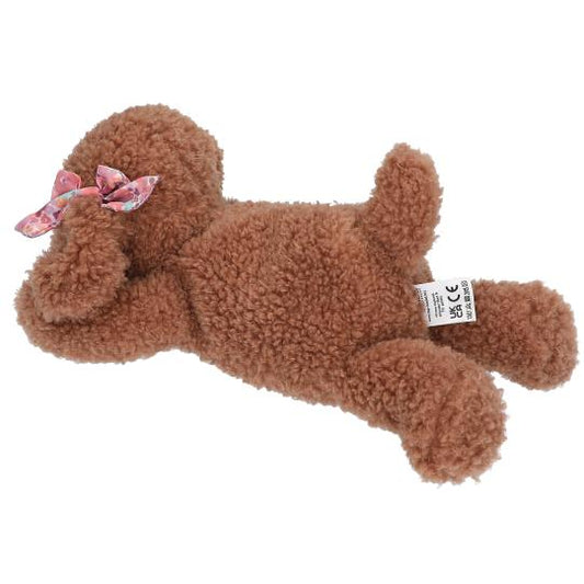 Brown plush dog toy with a bow on a white background