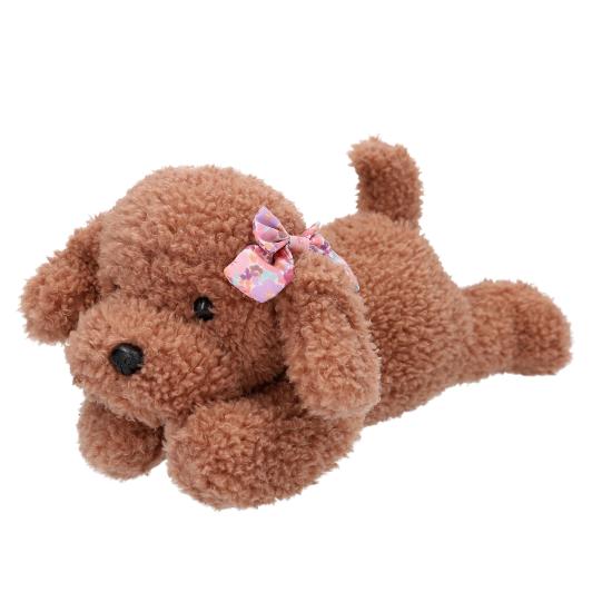 Brown plush dog toy with a pink bow on a white background