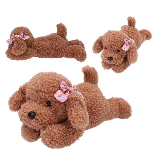 Three brown plush dogs with pink bows on a white background