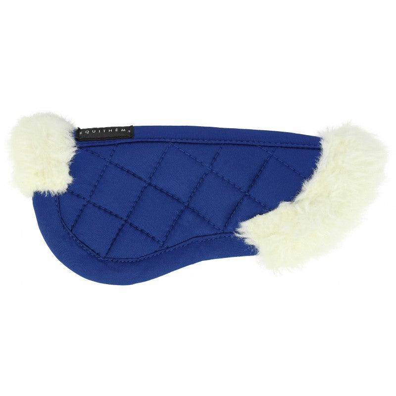 Blue equestrian saddle pad with white fur trim on a white background