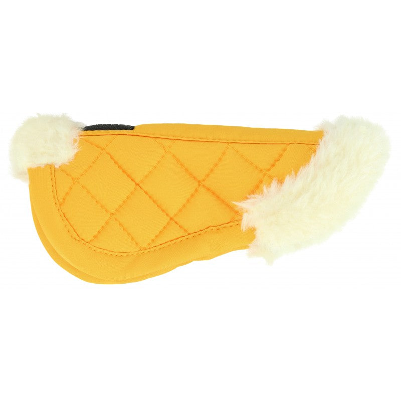 Yellow saddle pad with white fur trim on a white background