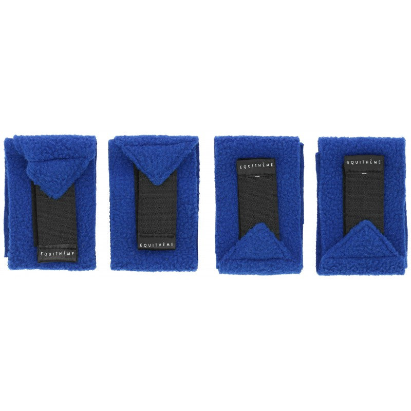 Four blue  bandages with visible branding on a white background