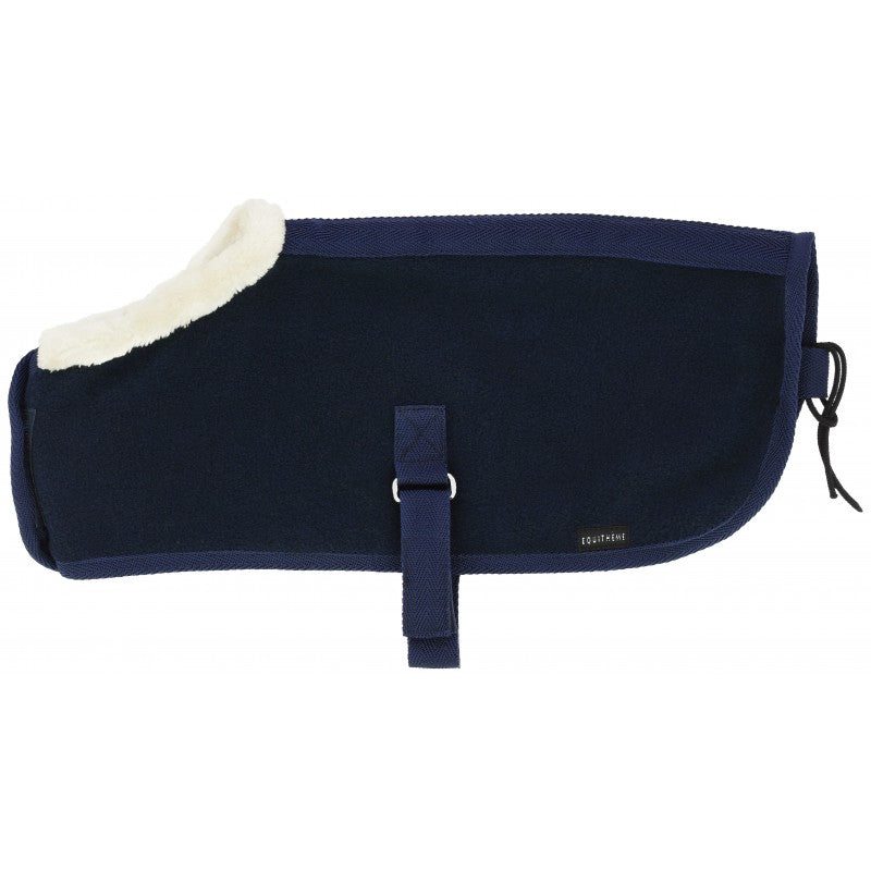 Navy blue horse blanket with white fleece lining on a white background