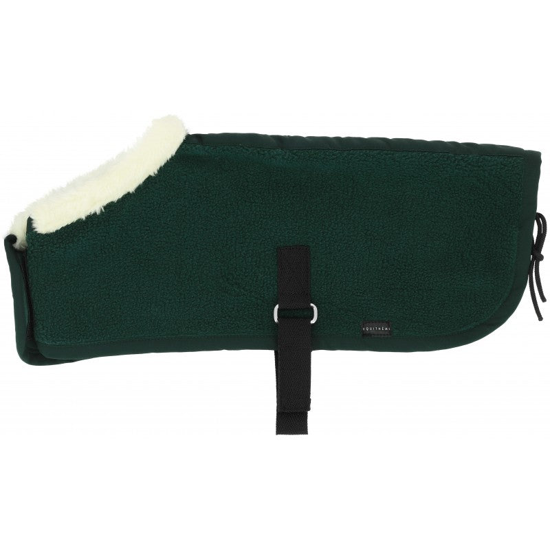 Green rug with white fur lining on a white background