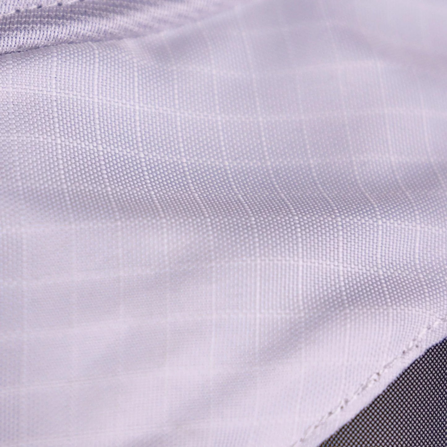 Close-up of a textured white fabric surface