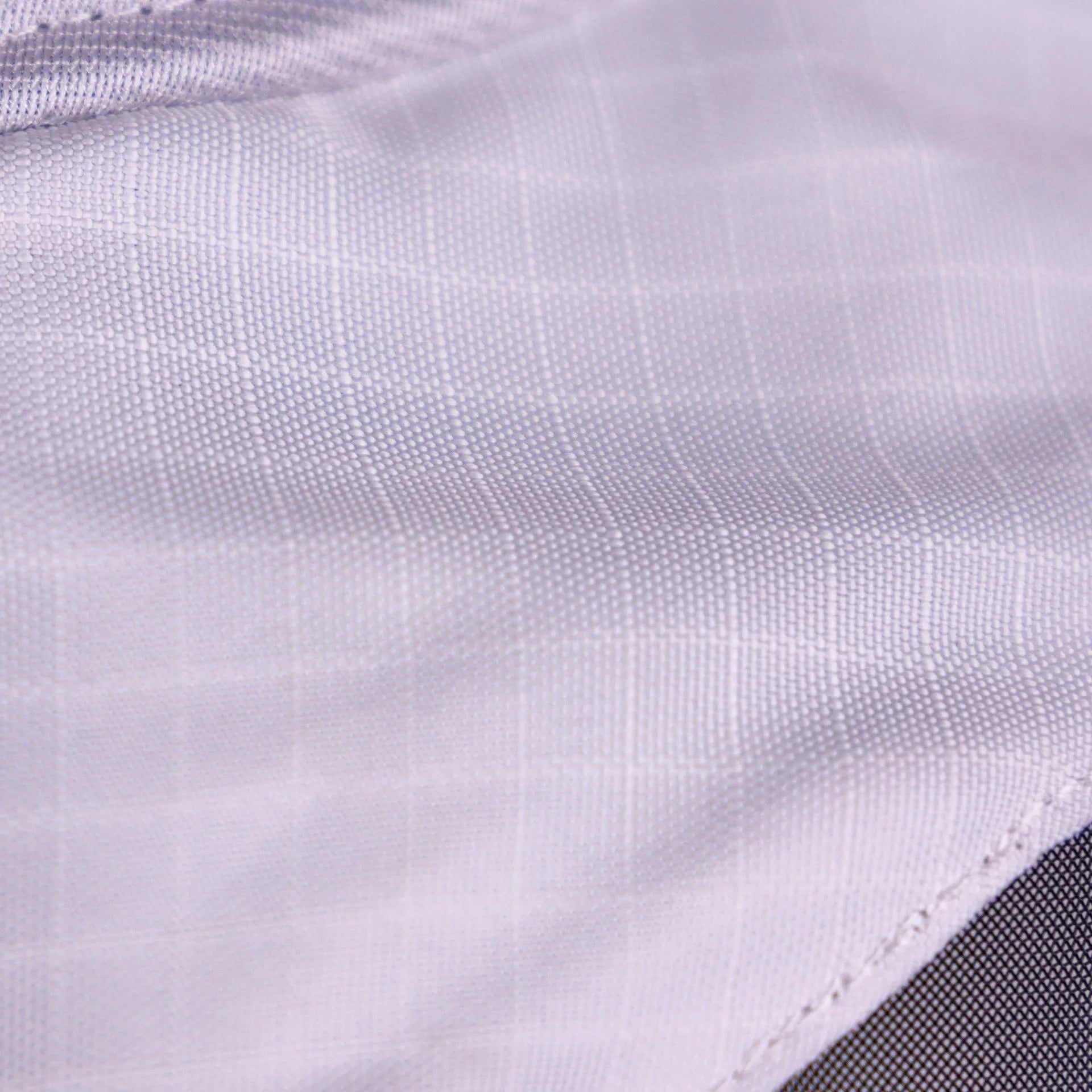 Close-up of a textured white fabric surface